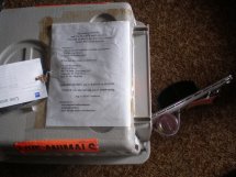 Place the paperwork pocket on the kennel, in a sheet cover taped to the top. It contains the contact phone numbers at both ends of the trip, and copies of the paperwork.